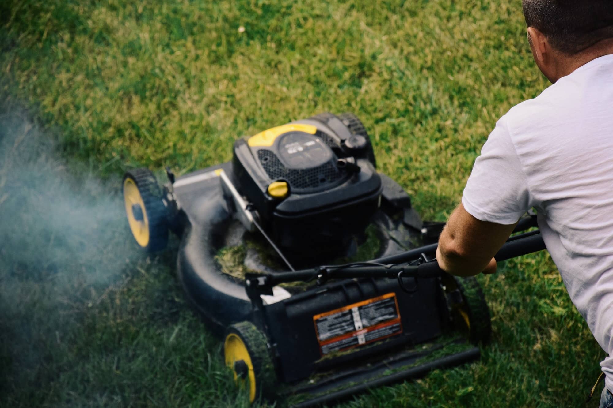 Man is mowing the lawn